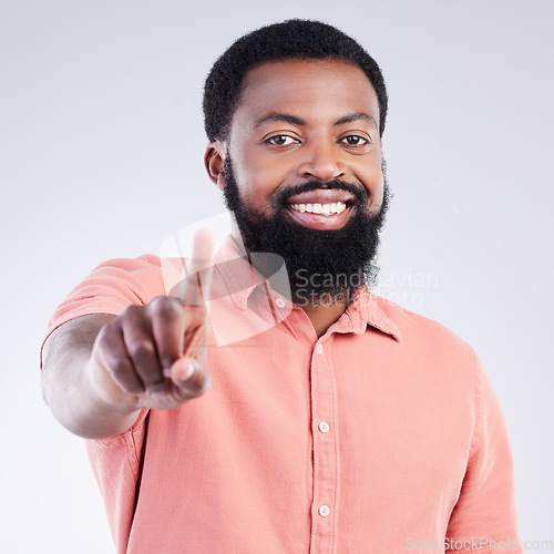 Image of Portrait, success and black man pointing to you, winner or motivation against white studio background. Face, African American male or guy with victory, happiness or winning with joy, space or inspire