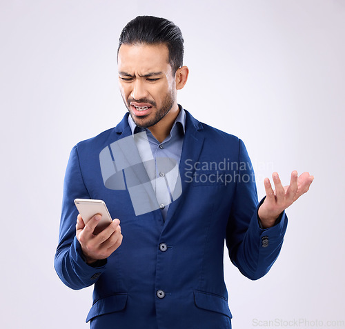 Image of Employee, smartphone and Asian man with stress, glitch and connection issue against studio background. Male entrepreneur, consultant or ceo with cellphone, problems or online reading with frustration