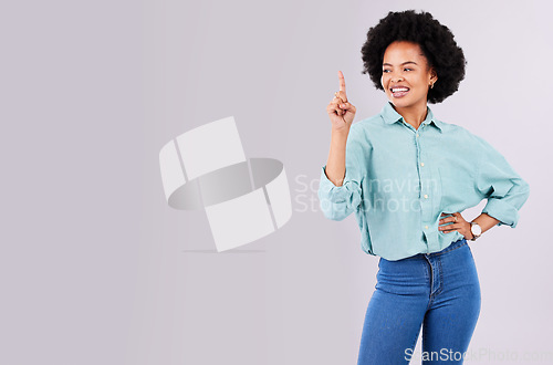 Image of Mockup, copy space and black woman point in studio for advertising, product placement and branding. Happy, smile and isolated female pointing on white background for show, choice and promotion sign