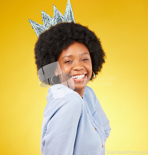 Image of Portrait, queen smile and black woman with crown in studio isolated on a yellow background. Paper, royal tiara and happy, beauty and confident African female model or princess with royalty pride.