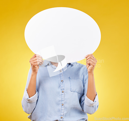 Image of Social media, person and hands with mockup speech bubble for opinion, marketing space or brand advertising. Product placement info, studio billboard and woman with voice mock up on yellow background