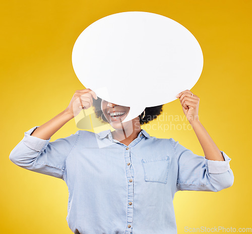 Image of Social media, studio smile and black woman with speech bubble for opinion, marketing space or brand advertising. Product placement, mock up billboard and person with voice mockup on yellow background