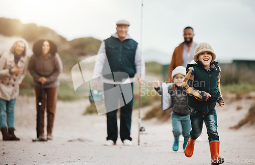 Image of Running, happy and family at the beach for fishing, hobby and weekend activity. Carefree, freedom and children, parents and grandparents playing by the ocean and ready to catch fish for recreation