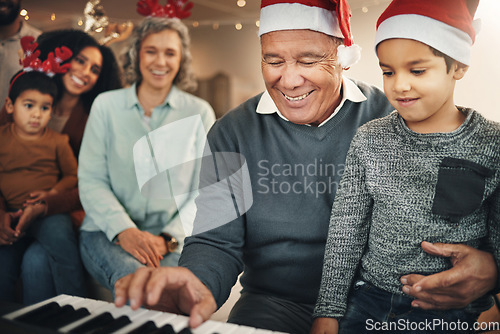 Image of Music, christmas and senior man with grandchild on piano for learning, teaching and bond in their home. Family, instrument and retired pianist performing for kids and parents in festive celebration