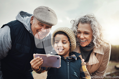 Image of Selfie, happy and child with grandparents in nature for bonding, quality time and babysitting. Smile, interracial and boy taking a photo with a senior man and woman for a holiday or weekend memory