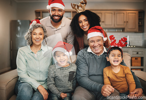 Image of Christmas, big family and portrait smile on sofa in living room in home, bonding and care. Xmas, laughing and happy grandmother, grandfather and parents with boys or children enjoying holiday time.