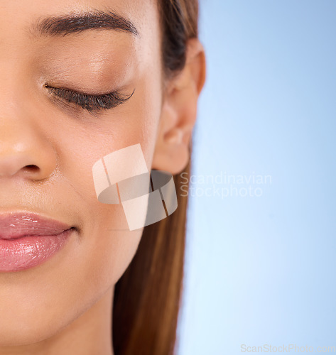 Image of Beauty, half face and relax woman with luxury skincare glow, closeup makeup foundation or facial cosmetics mockup. Studio dermatology, spa salon and calm aesthetic female on mock up blue background