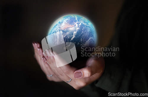 Image of Woman, hands and earth on black background, sustainability in future conservation of environment. Climate change, global care and hope, protection for planet and safety or security for mother nature.