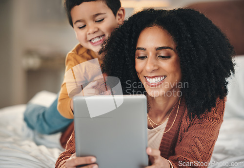 Image of Tablet, mother and kid relax on bed, bonding and streaming movie, film or video online. Technology, care and smile of happy mama with touchscreen for learning development with boy or child in bedroom