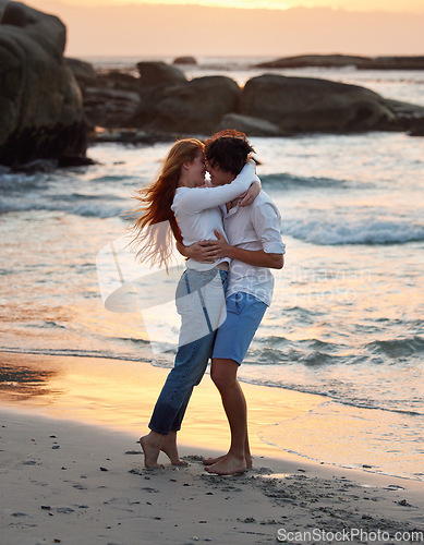 Image of Couple hug on beach, freedom and travel, love and commitment in relationship, adventure and vacation. Trust, partnership and care with people outdoor, romance and happiness at sunset with sea waves