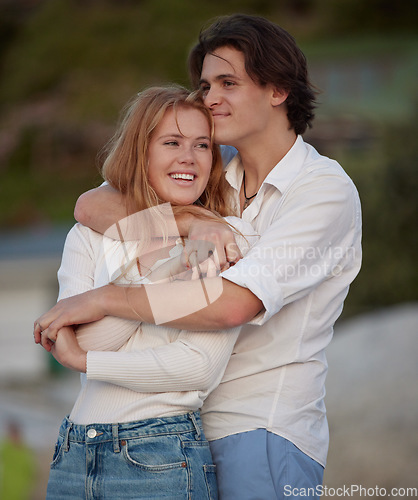 Image of Couple hug on beach, travel and content with love and commitment in relationship, adventure and romance. Trust, partnership and care with young people outdoor, tropical holiday and happiness on date