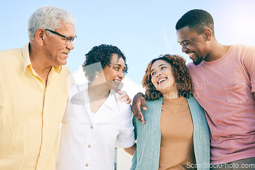 Image of Happy family, couple and parents on vacation or holiday bonding together smile and having fun outdoors. People, man and woman embrace with mother and father as love, care and support during weekend