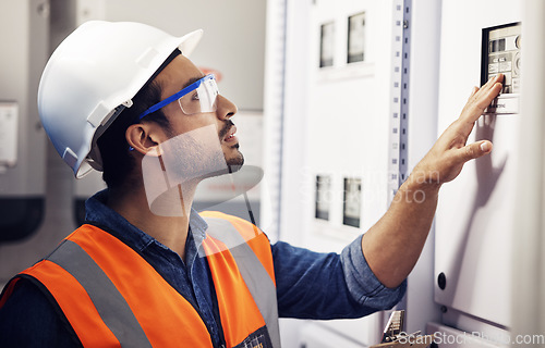 Image of Man, switch box and technician in control room, mechanic inspection and machine maintenance. Male electrician, system and electrical substation for electricity, industrial generator and engineering