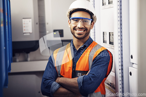 Image of Portrait, happy man and engineering technician in control room, inspection service or industry maintenance. Electrician, arms crossed and smile in electrical substation, system or industrial mechanic