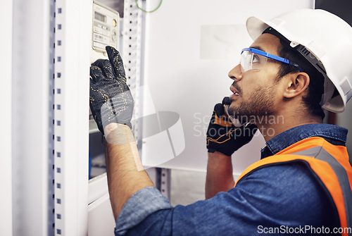 Image of Man, phone call and engineering in control room, switchboard and power box inspection. Male electrician talking on smartphone at power box, server mechanic and electrical substation maintenance