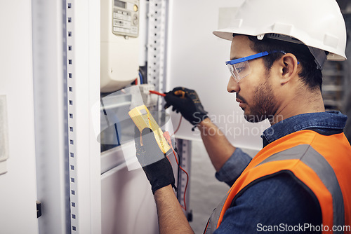 Image of Technician, man and multimeter testing power for electricity, energy inspection and electrical system. Electrician, engineering and voltage test tool for machine, industrial mechanic and control room