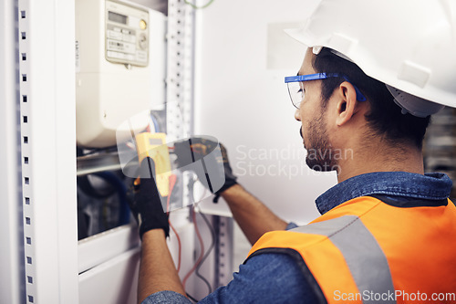 Image of Technician, man and multimeter testing power for electricity, energy inspection and electrical system. Electrician, engineering and voltage test tool for machine, industrial mechanic and control room