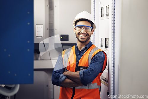 Image of Portrait, happy man and engineering technician in control room, inspection service or industry maintenance. Electrician, arms crossed and smile in electrical substation, system or industrial mechanic