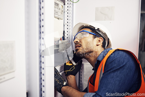 Image of Man, phone call and engineering in control room, switchboard or industrial system inspection. Male electrician talking on smartphone at power box, server mechanic or electrical substation maintenance