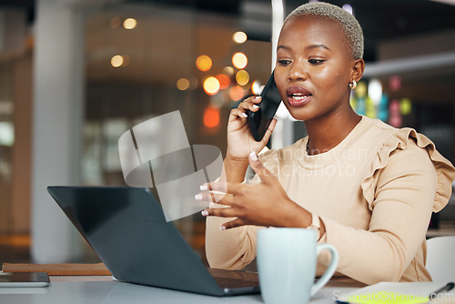 Image of Phone call, business and black woman talking in office, chatting or speaking to contact. Laptop, cellphone and female professional in conversation, networking or discussion with smartphone at night.