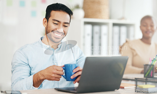 Image of Laptop, coffee and smile with a business man at work in his office, taking a break during a project. Computer, drink and internet search with a male employee working on an email, proposal or review