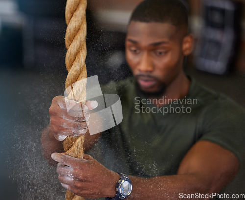 Image of Fitness, rope and black man training, powder and exercise for endurance, balance and healthy lifestyle. Male athlete, guy and strength with workout, power and intense movement for energy and focus