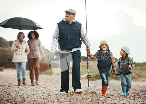 Image of Family, fishing vacation and man, women and happy kids at ocean, weekend hobby and fun together. Grandparents, mom and excited children walking at beach or lake on winter holiday adventure in nature.