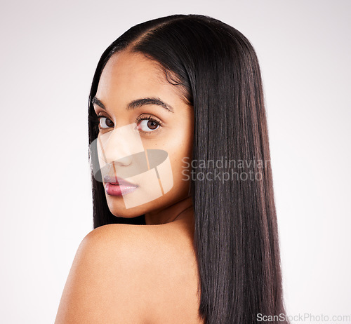 Image of Hair, skin glow and beauty portrait of a woman in a isolated, white background and studio with salon treatment. Cosmetics, self care and young female model with healthy hairstyle texture and makeup