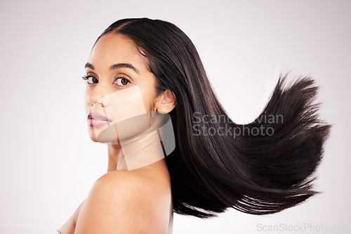 Image of Beauty, hair care and portrait of woman in studio for shampoo, confidence and keratin treatment. Textures, salon and shine with female model on white background for glow, self love and cosmetics