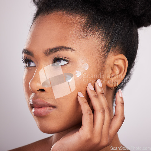 Image of Skincare, beauty and black woman with cream on face for anti aging or fresh skin glow on white background. Cosmetics, facial and lotion, African model with moisturizer or cleansing product in studio.