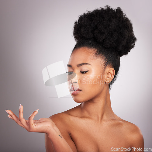 Image of Beauty, skincare and hand of black woman with product placement for cosmetics on white background. Studio, mockup and makeup presentation, African model with glowing skin and spa or salon treatment.