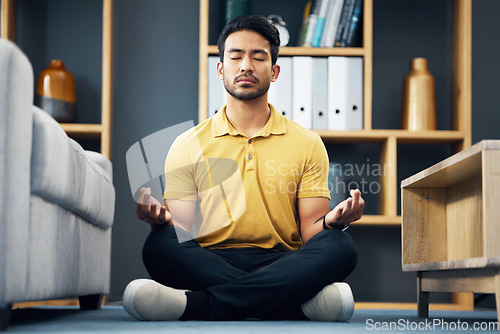 Image of Meditation, zen and relax, man on living room floor with calm breathing exercise and time for mind wellness. Peace, balance and Indian person in lounge to meditate with concentration and mindfulness.