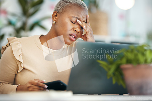 Image of Stress, headache and black woman in the office while working on project with a laptop. Burn out, tired and professional African female business employee with a migraine in modern corporate workplace.