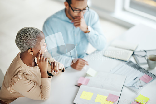 Image of Collaboration, planning overhead and a business black woman at work with a man colleague in an office. Teamwork, strategy and documents with professional people brainstorm thinking while working