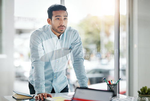 Image of Manager, leader and business man in a presentation or meeting in a boardroom planning a company strategy. Confident, serious and male employee at a startup with a vision, idea and in a office