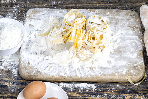 Image of raw pasta with flour