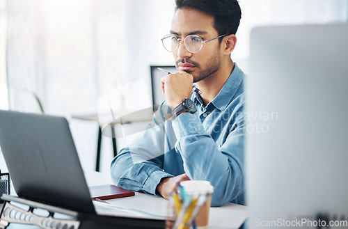 Image of Serious, business man and thinking on laptop in office, startup company or agency. Focused male employee, computer and solution of inspiration, ideas or planning goals of decision, review or strategy