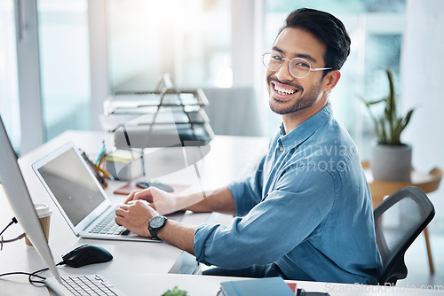 Image of Happy business man, portrait and laptop in office for happiness, startup management and planning. Young male worker, smile and computer technology with motivation, online project and pride at desk