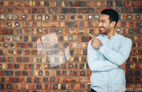 Image of Pointing, mockup and smile with man and wall background for announcement, product placement and offer. Idea, news and deal with male and hand gesture with for information, empty space and opportunity