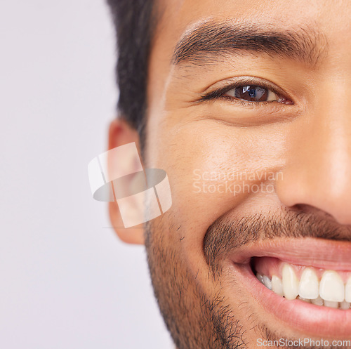 Image of Half, face and teeth of a man with dental, oral and mouth hygiene isolated against a studio white background. Smile, clean and whitening treatment for a happy male feeling excited and confident