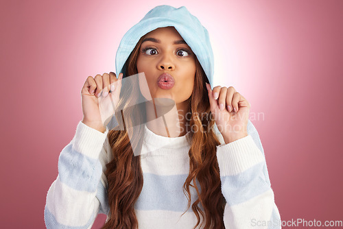 Image of Fashion, comic face and portrait of woman on studio background for funny face, kiss and emoji reaction. Beauty, facial expression and happy girl model for trendy style, cosmetics and casual clothes