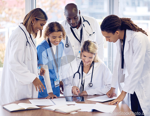 Image of Doctors group discussion, tablet and desk with documents, results or report with teamwork, good news and support. Team, touchscreen and big data analysis for progress, development or medical research