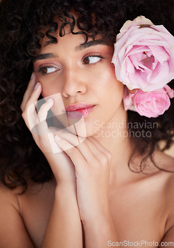 Image of Beauty, flowers and face of woman with makeup, cosmetics and hair care for wellness, glamour and glow in studio. Salon aesthetic, luxury spa and girl model for natural, skincare and facial treatment