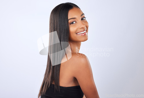 Image of Portrait, beauty and Indian woman with hair care, texture and happiness against grey studio background. Face, female and lady with cosmetics, luxury and salon treatment for shine, glow and self care