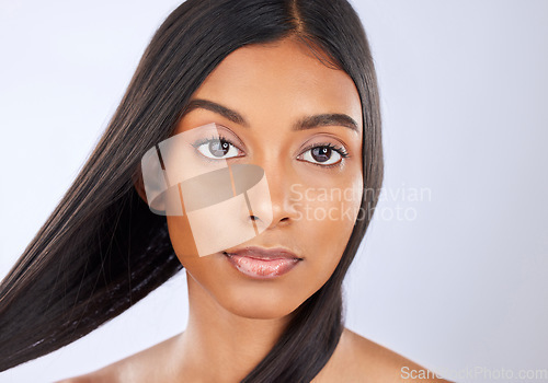 Image of Hair care, salon and portrait of woman with beauty isolated on a white background in a studio. Serious, young and an Indian model with a keratin treatment, straight and silky hairstyle on a backdrop