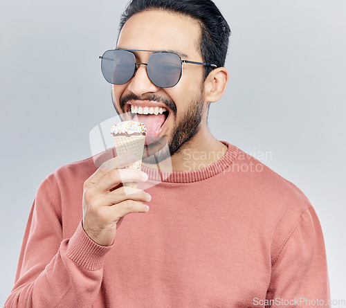 Image of Ice cream, happy and man in studio with dessert, fun and eating snack against grey background. Cone, sweet and mexican male smile, cheerful and carefree on mockup, space or isolated copy space