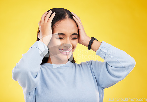 Image of Headache, stress and woman in a studio with brain fog, tension and frustrated from burnout. Anxiety, young female and wellness problem of a sick person with mental health issue and pain from migraine