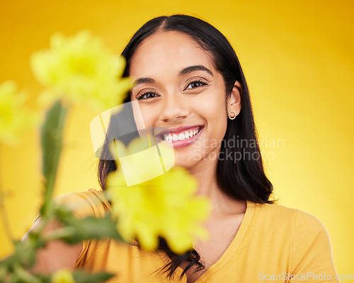 Image of Flowers, happy and portrait of woman on yellow background with smile, happiness and cosmetics. Spring mockup, beauty and face of girl with floral blossom for nature, aesthetic and natural makeup