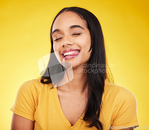 Image of Funny, happy and woman with tongue out, silly and cheerful on studio background. Comic, female and lady with happiness, goofy and facial expression with joy, amusing and humor face with crazy gesture