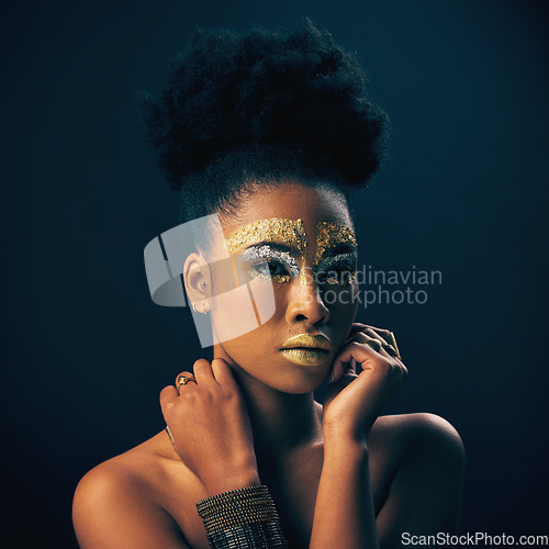 Image of Gold, glitter and style with black woman and makeup in studio for luxury, cosmetics and African pride. Natural, creative and goddess with female model on background for queen, bronze and glamour